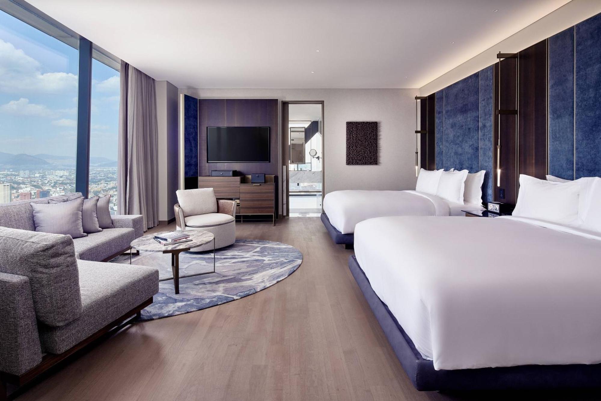 Deluxe Corner Queen Room Two Queen Beds City View