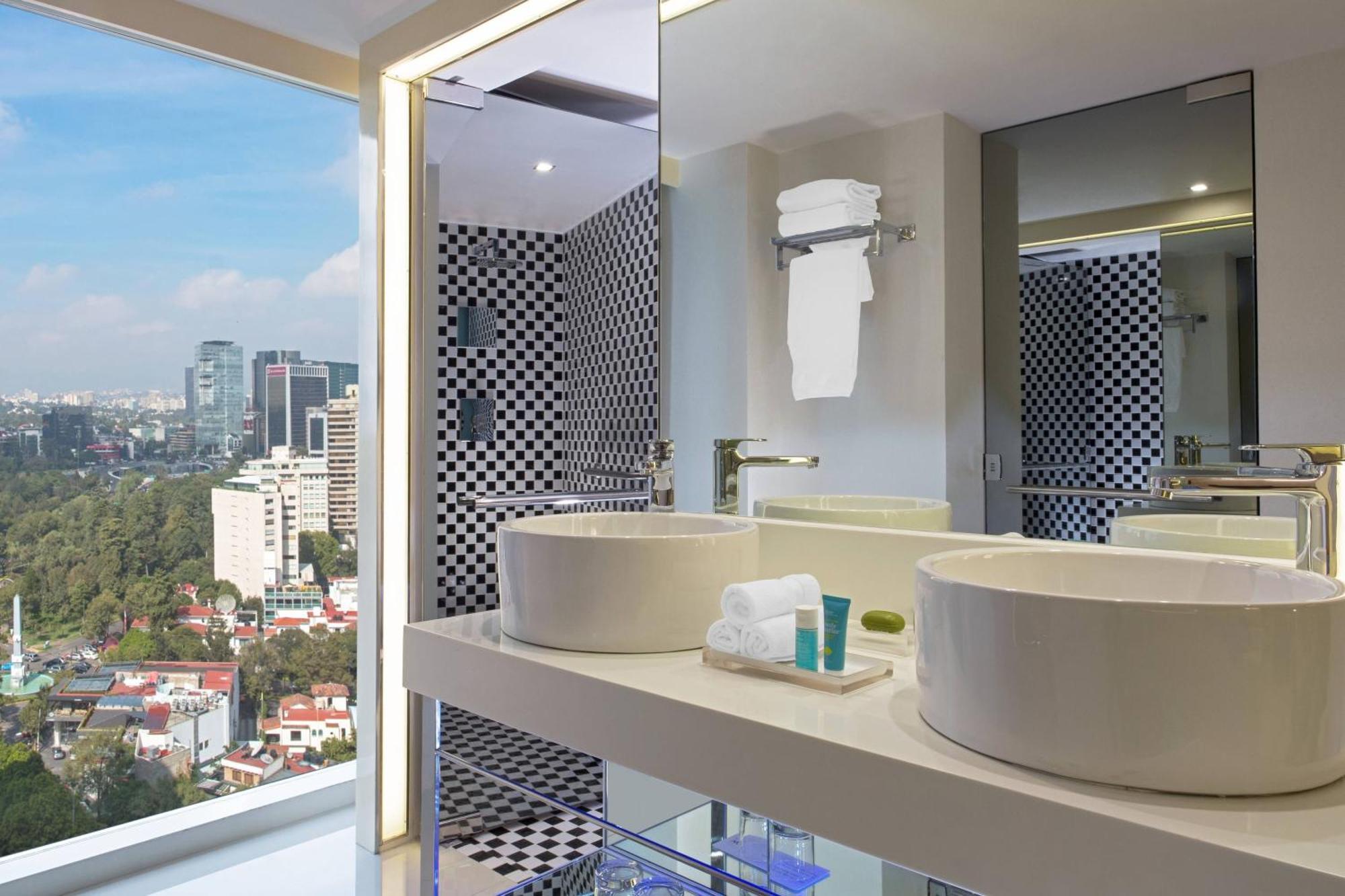 Deluxe Queen Room with Two Queen Beds and Partial City View